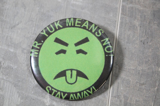 Pinback button featuring mr yuk saying no means no stay away