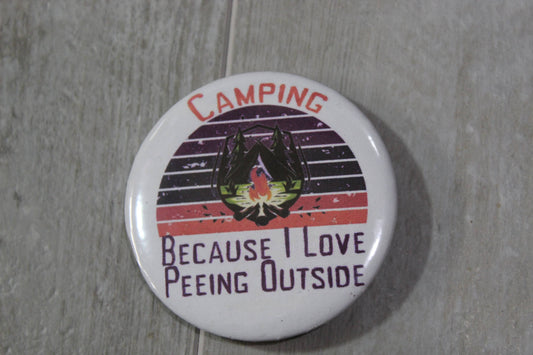 metal pin back button white with lines and picture of campfire with words Camping because I love peeing outside