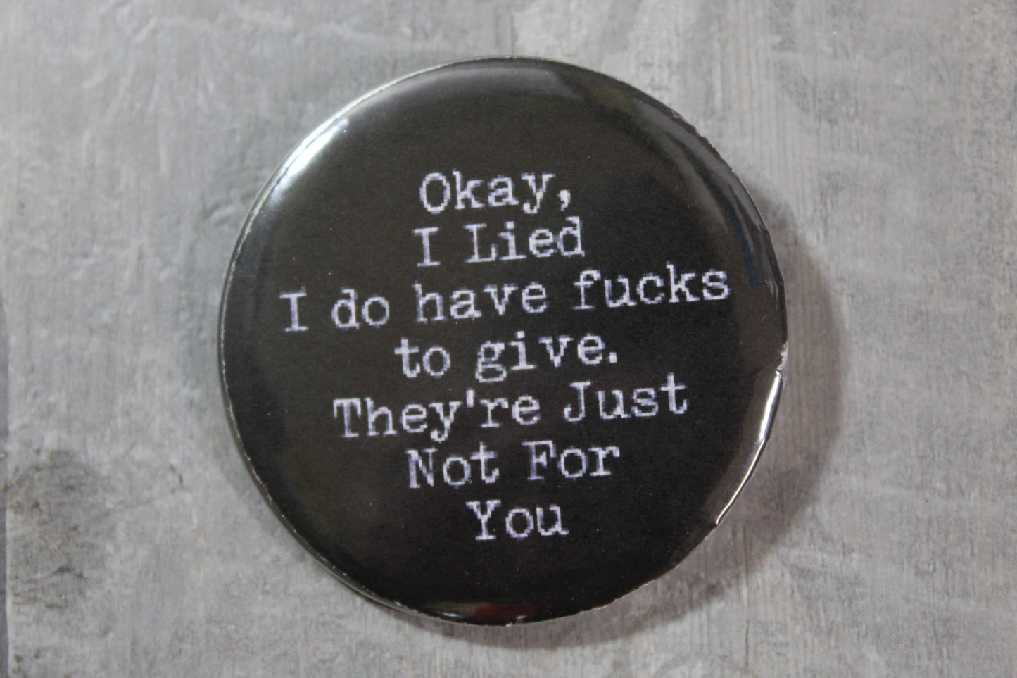 black pinback button with saying okay i lied i do have fucks to give. they are just not for you